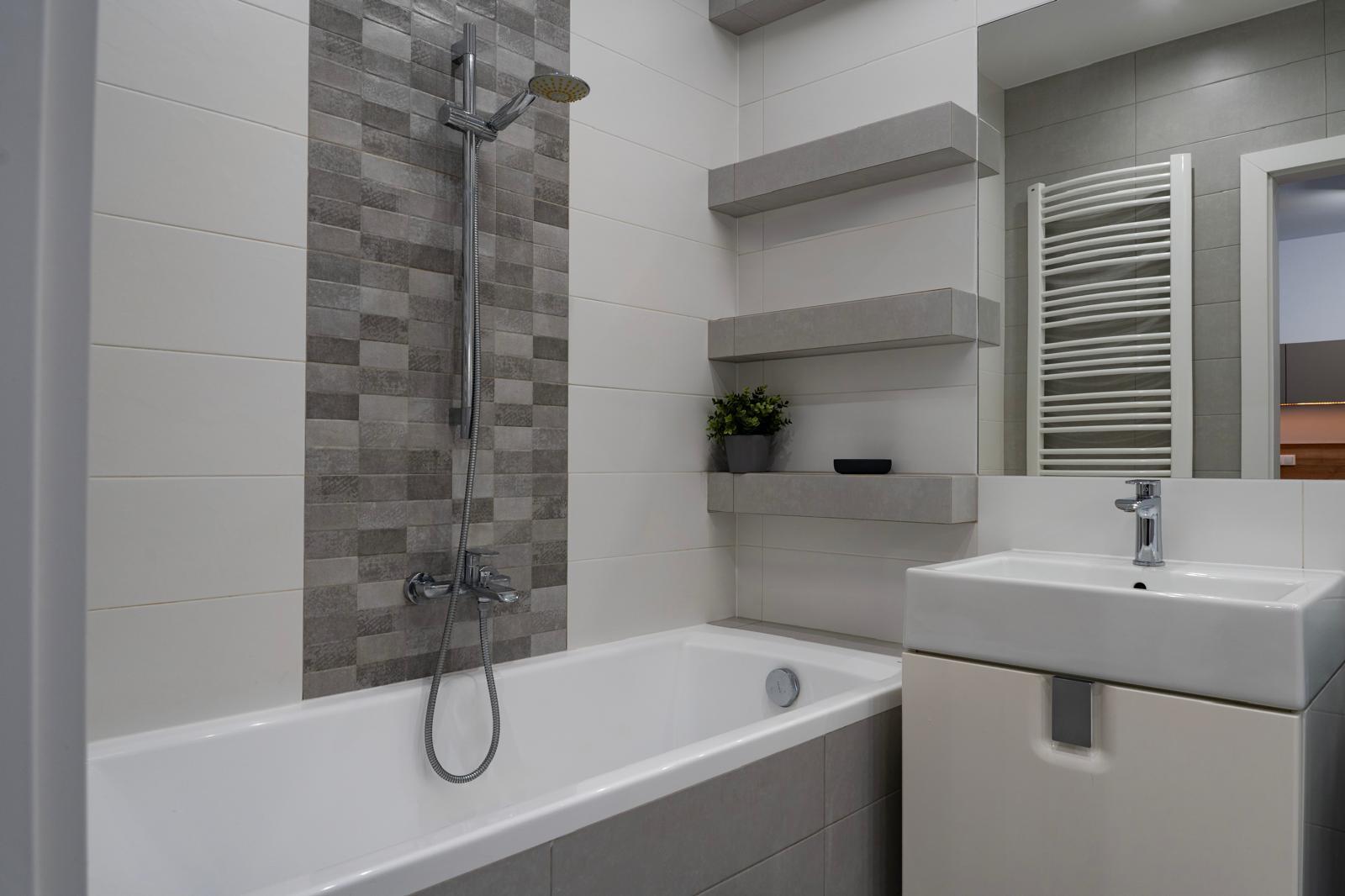 Clean bathroom detail real estate photography with bathtub and mirror